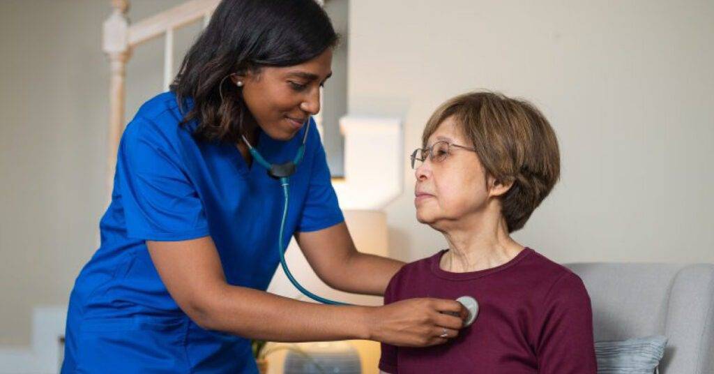 Doctor using stethoscope to examine patient