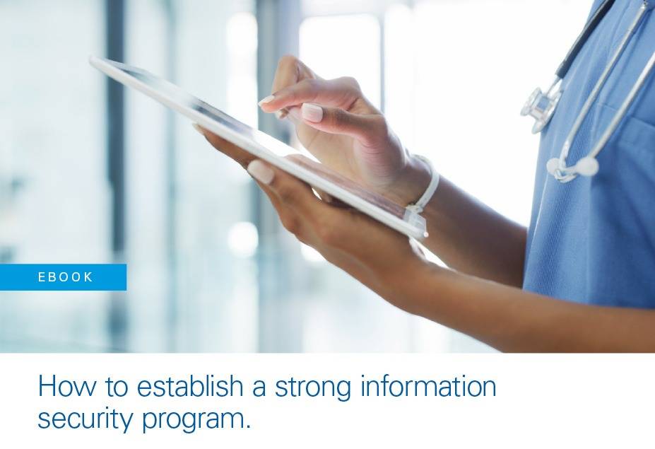 doctor typing on tablet