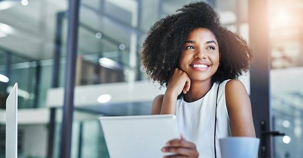 young BIPOC professional uses mobile tablet