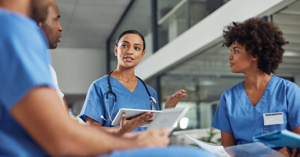 nurses and doctors talking